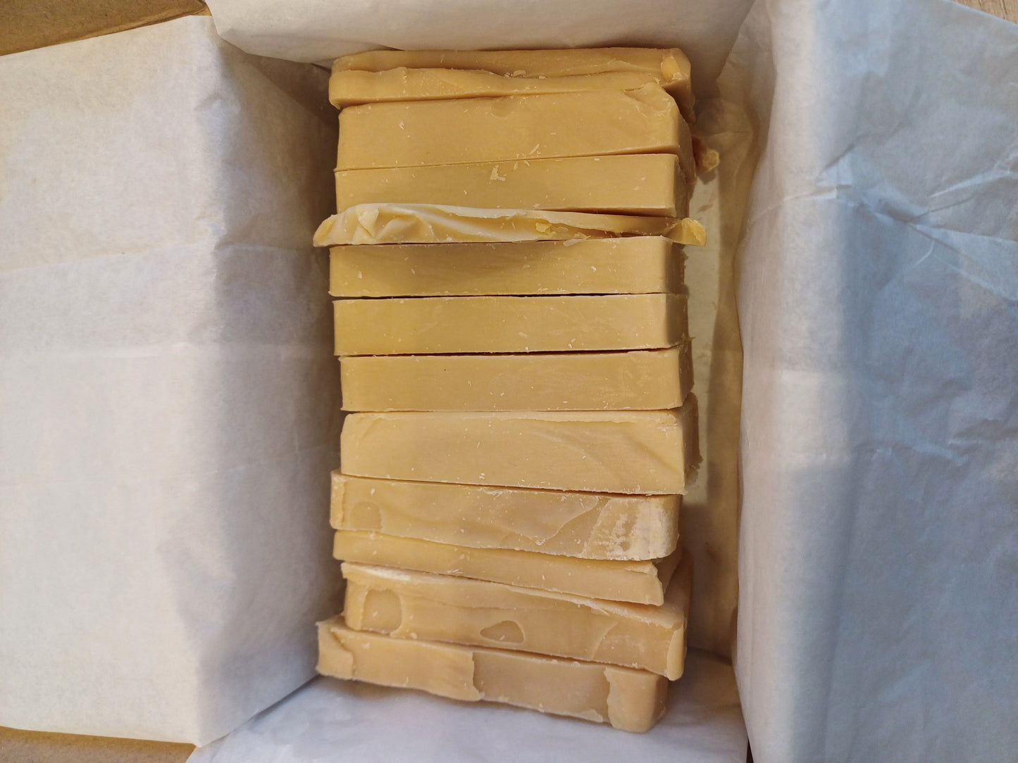 Box containing lots of seconds quality ends of Mama's Citrus burst soap