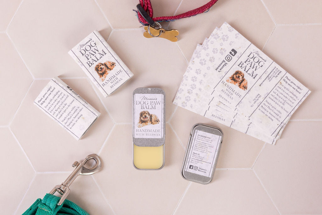 Moisturizing dog paw and nose balm with beeswax and natural oils, perfect for protecting against dry, cracked skin.  Plastic free tin and seeded paper wrapper