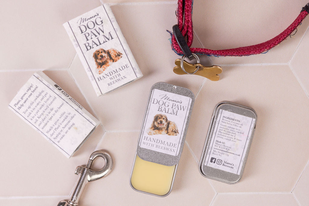 Moisturizing dog paw and nose balm with beeswax and natural oils, perfect for protecting against dry, cracked skin. Plastic free tin and seeded paper wrapper