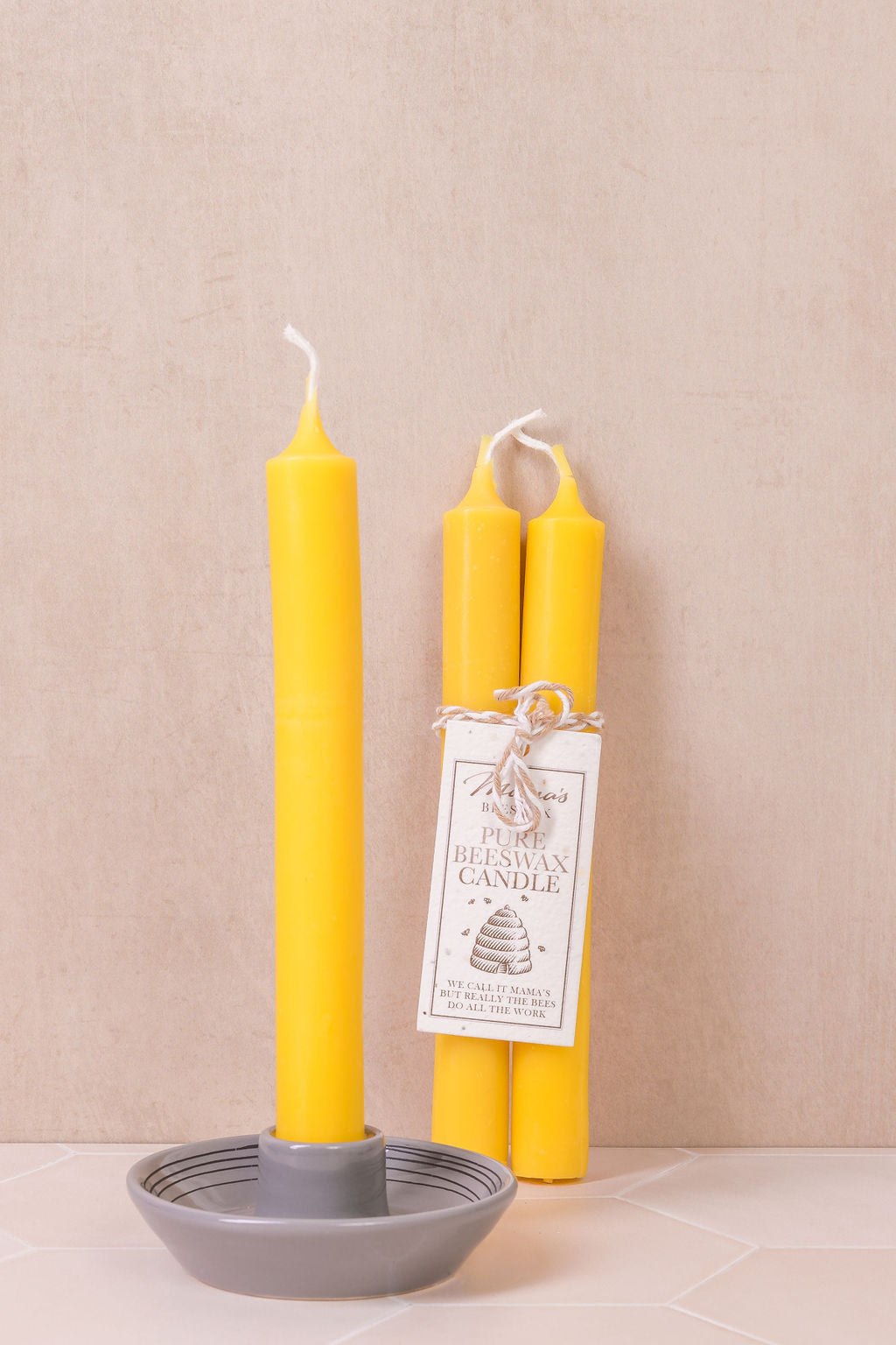 Elegant long-burning beeswax candles with a seeded paper label to grow wildflowers