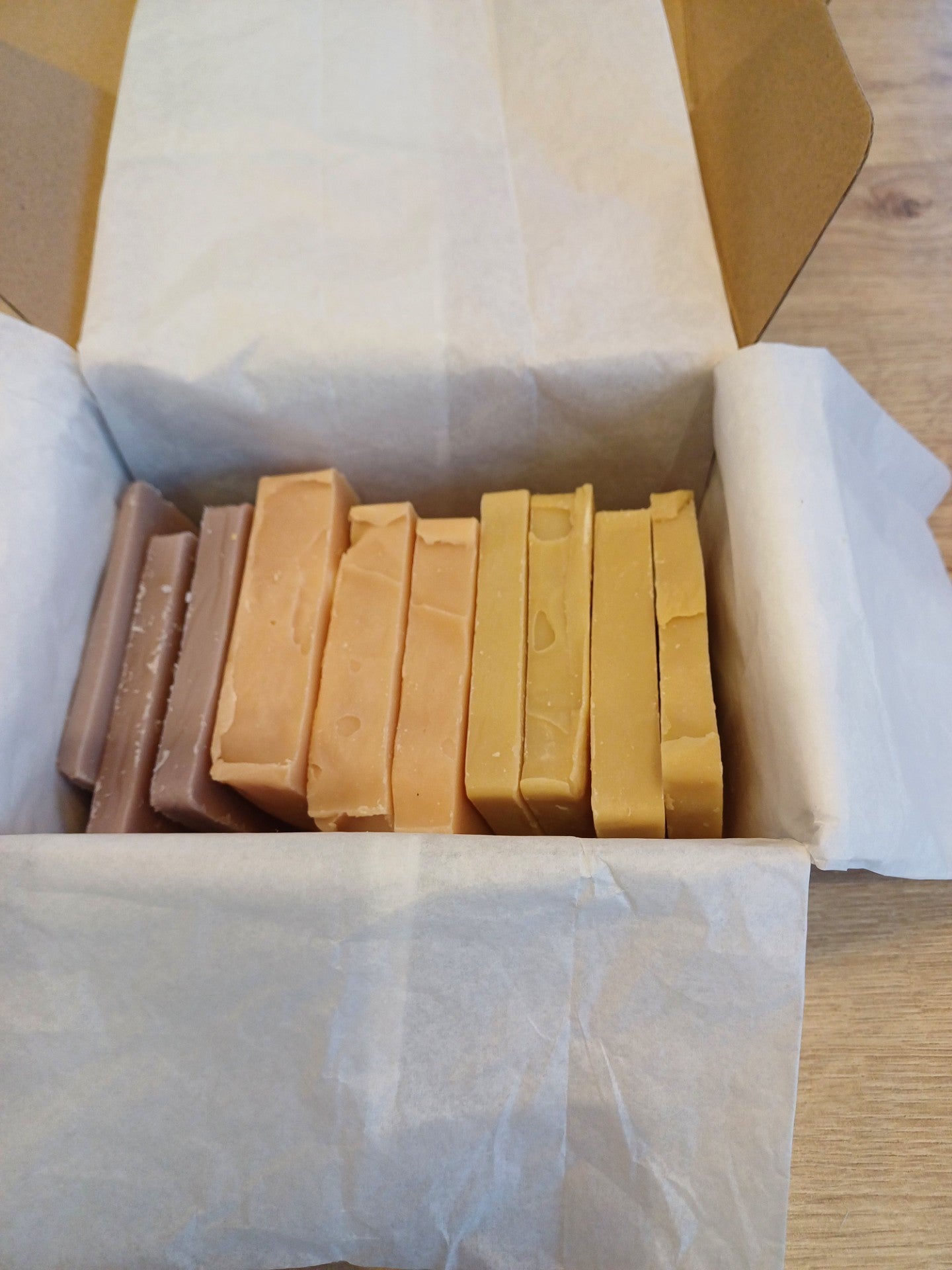 A box of Mama's soap crusts with various shapes and colors, including Relaxing Lavender, Classic Garden and Citrus Burst.
